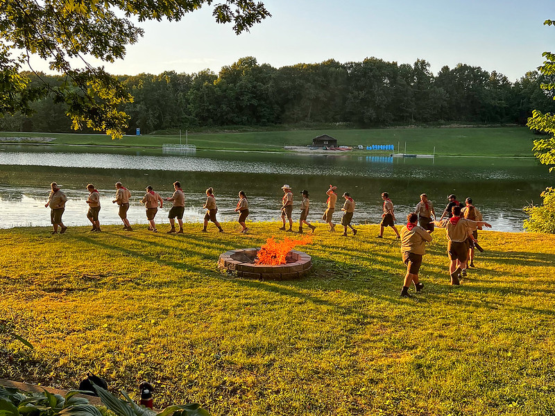 Campfire Program scouts around camp fire photo